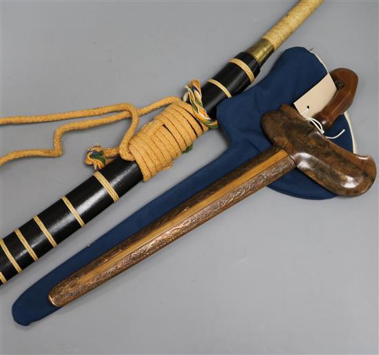A Chinese Dao sword with rope-bound brass-ended grip and ebonised scabbard and a decorative Kris-type dagger